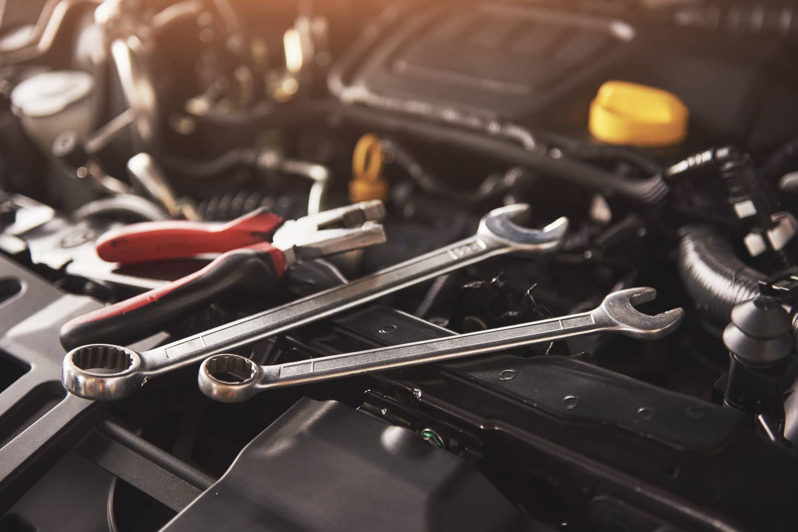 mechanic-hand-checking-fixing-broken-car-car-service-garage1600